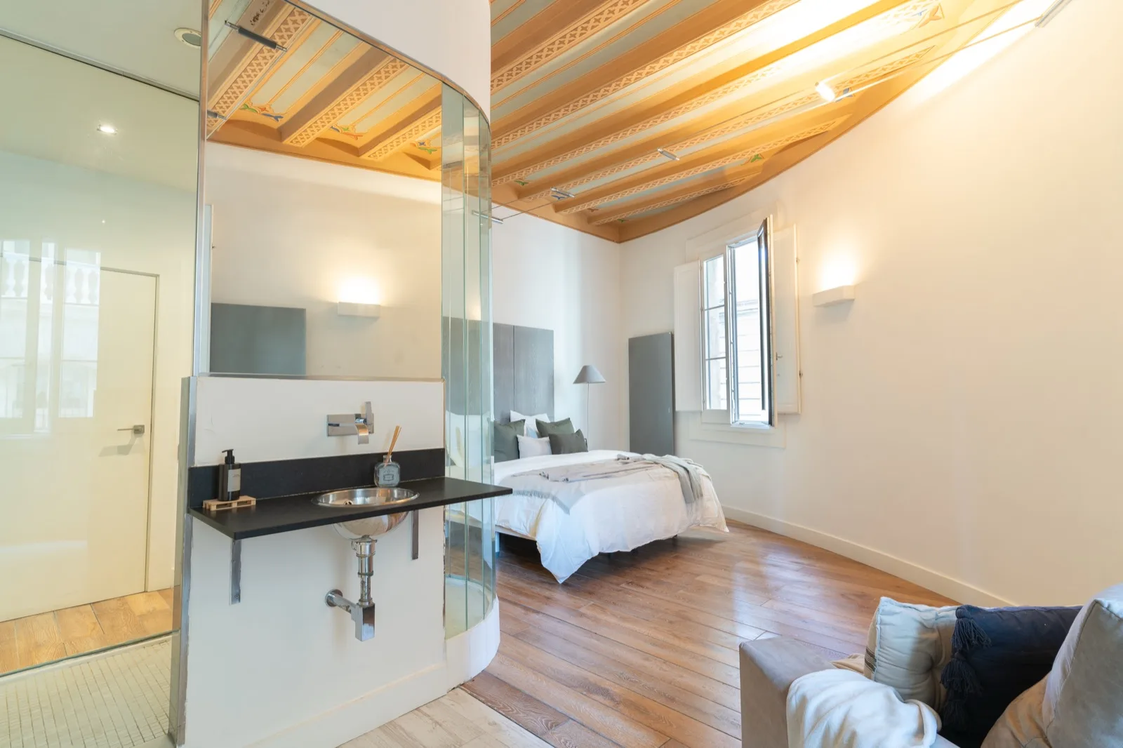Bedroom in a Viver apartment at Plaça Sant Jaume 2, Barcelona.